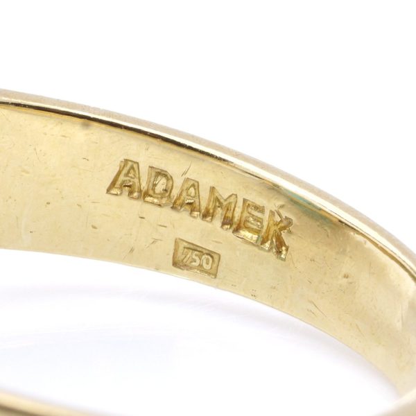 Blue zircon and diamond ring in gold.