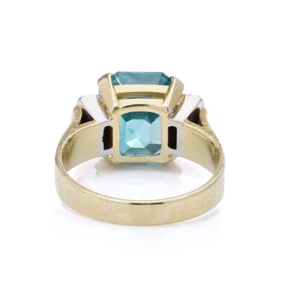 Blue zircon and diamond ring in gold.