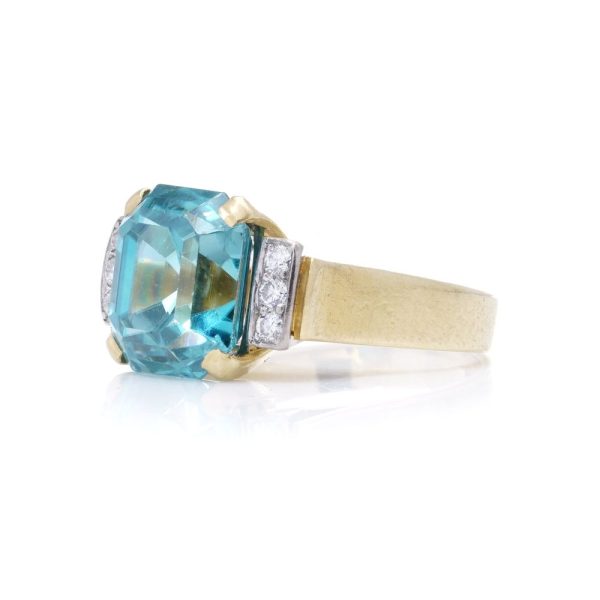 Blue zircon and diamond ring in gold.