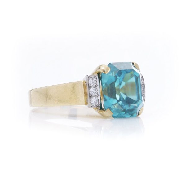 Blue zircon and diamond ring in gold.