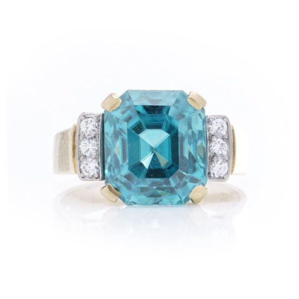 Blue zircon and diamond ring in gold.
