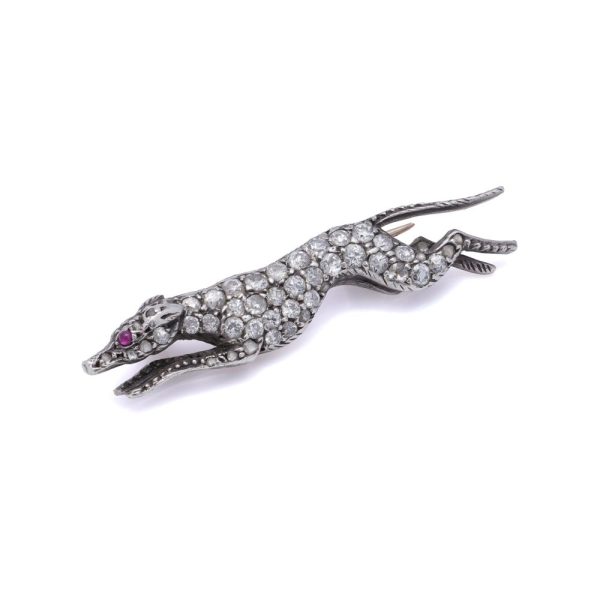 Antique gold and silver greyhound brooch with diamonds and ruby.