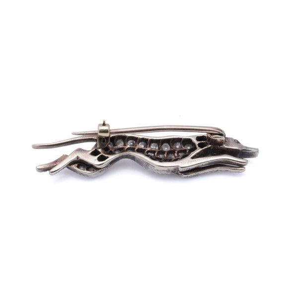 Antique gold and silver greyhound brooch with diamonds and ruby.