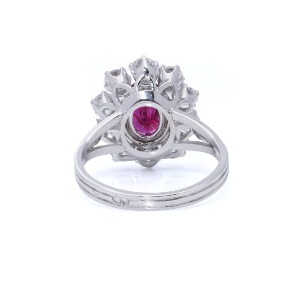 Vintage ruby and diamond cluster ring in gold.