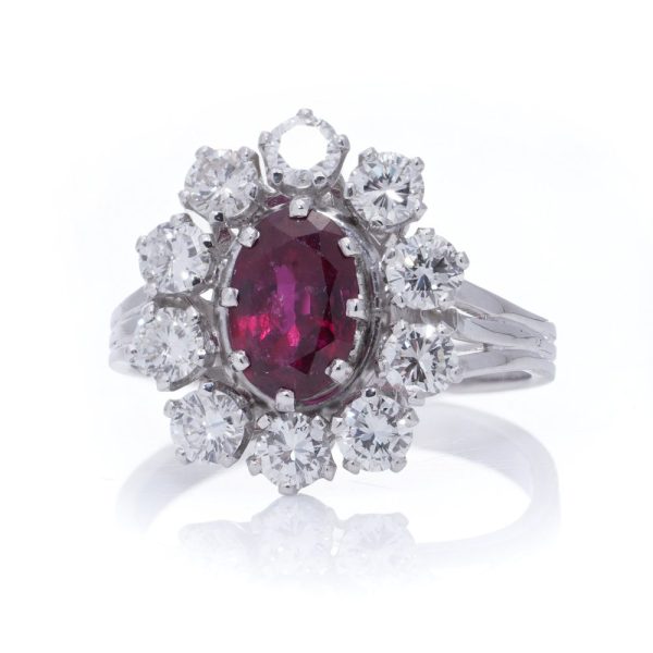 Vintage ruby and diamond cluster ring in gold.