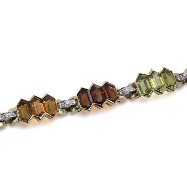 Bulgari 18 carat gold bracelet with multicoloured gemstones and diamonds. 
