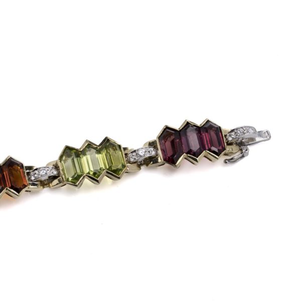 Bulgari 18 carat gold bracelet with multicoloured gemstones and diamonds. 