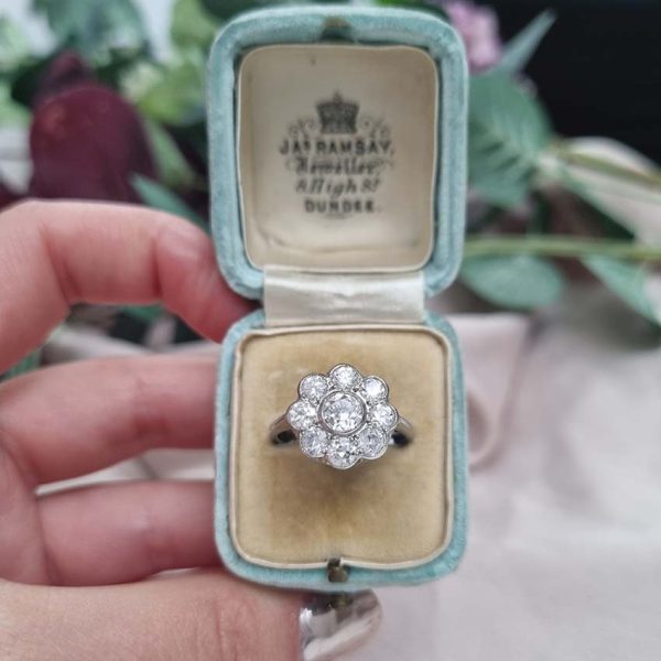 Art Deco 1.25ct Old Cut Diamond Floral Cluster Engagement Ring, set with 1.25 carats of old-cut diamonds Mounted in platinum in rubover settings