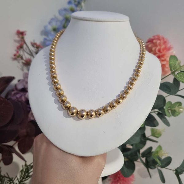 Vintage Graduating Yellow Gold Bead Necklace, underlying chain strung with polished 14ct yellow gold beads measuring from 9.5mm to 4.5mm. Circa 1930s