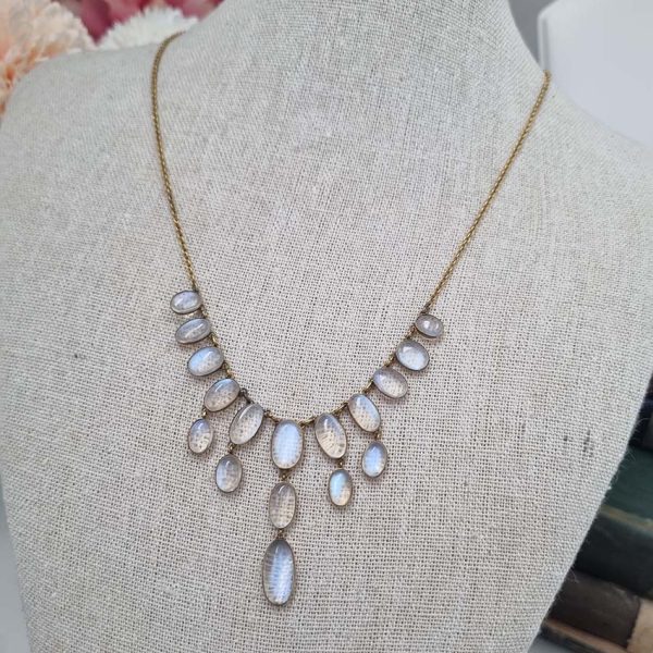 Antique Arts and Crafts Moonstone Fringe Necklace, set with graduating drops of spectacle set oval cabochon moonstone. Circa 1890