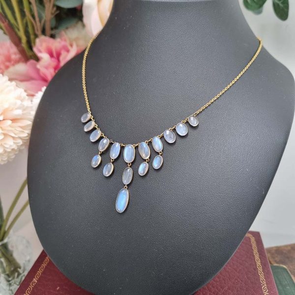 Antique Arts and Crafts Moonstone Fringe Necklace, set with graduating drops of spectacle set oval cabochon moonstone. Circa 1890