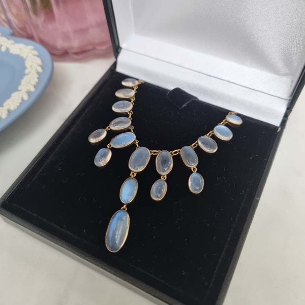 Antique Arts and Crafts Moonstone Fringe Necklace, set with graduating drops of spectacle set oval cabochon moonstone. Circa 1890