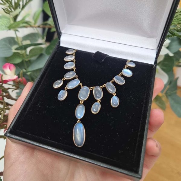 Antique Arts and Crafts Moonstone Fringe Necklace, set with graduating drops of spectacle set oval cabochon moonstone. Circa 1890