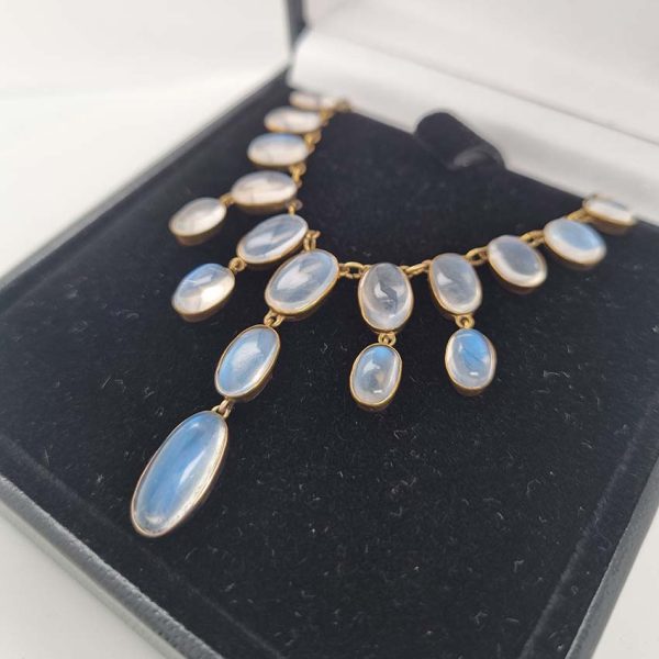 Antique Arts and Crafts Moonstone Fringe Necklace, set with graduating drops of spectacle set oval cabochon moonstone. Circa 1890