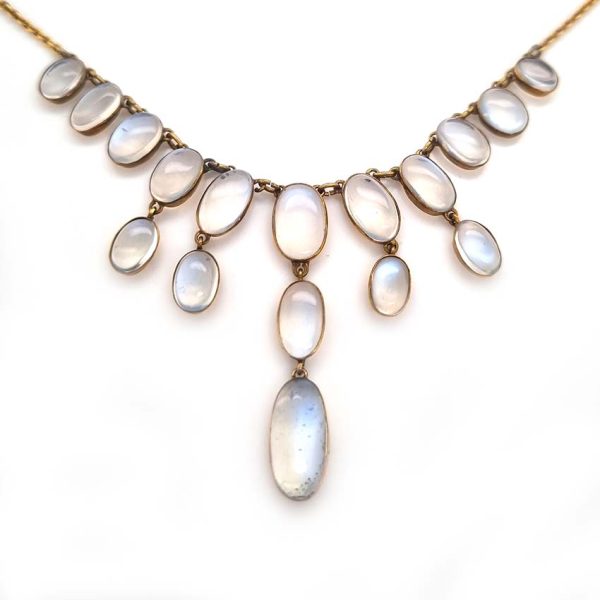 Antique Arts and Crafts Moonstone Fringe Necklace, set with graduating drops of spectacle set oval cabochon moonstone. Circa 1890