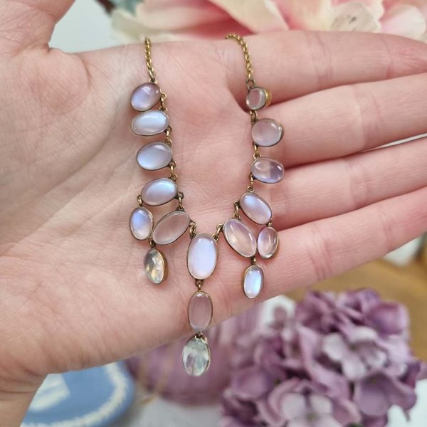 Antique Arts and Crafts Moonstone Fringe Necklace, set with graduating drops of spectacle set oval cabochon moonstone. Circa 1890