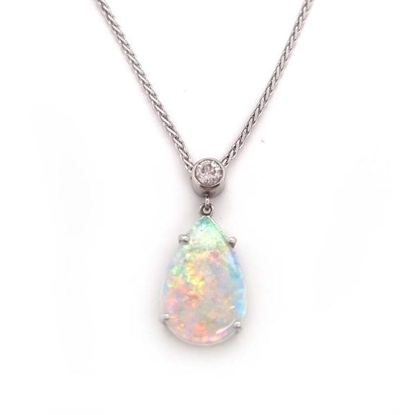 Pear Shaped Opal and Diamond Pendant Necklace, pear cabochon-cut opal topped with bezel set brilliant-cut diamond in 18ct white gold with fixed spiga chain