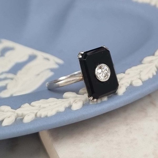 Art Deco Old Cut Diamond and Onyx Plaque Tablet Ring, emerald-cut black onyx tablet with central 0.25ct old European-cut diamond in platinum. French Circa 1920