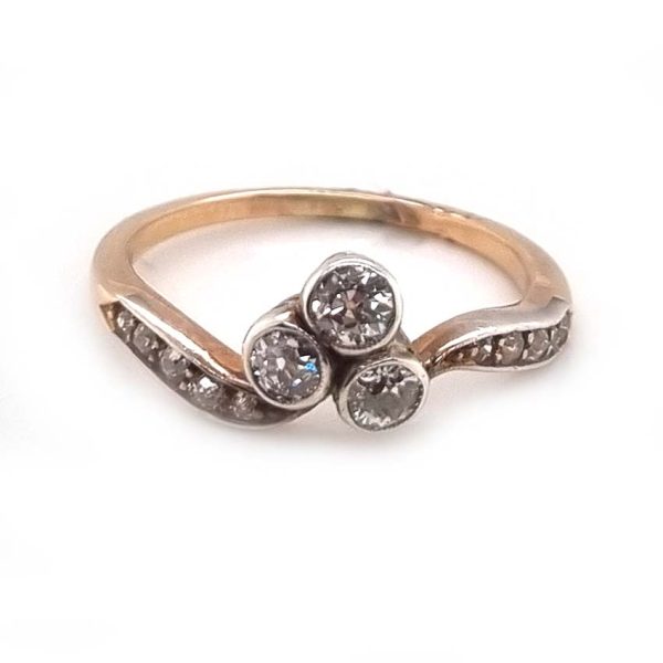 Edwardian Antique Diamond Trefoil Ring, three old European transitional cut diamonds in trefoil design in platinum to 18ct yellow gold band. Circa 1900