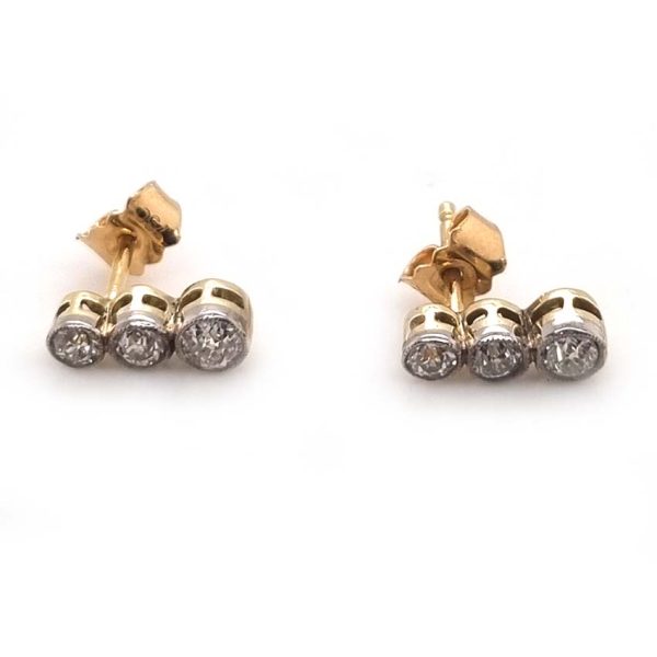 Edwardian Antique Diamond Drop Earrings, three slightly graduated old European transitional cut diamonds in platinum to 18ct yellow gold. Circa 1900