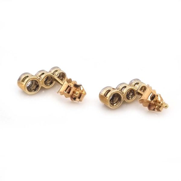Edwardian Antique Diamond Drop Earrings, three slightly graduated old European transitional cut diamonds in platinum to 18ct yellow gold. Circa 1900