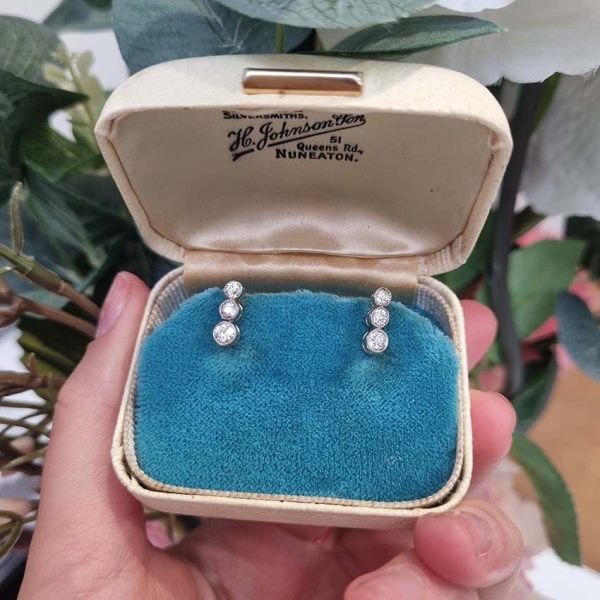 Edwardian Antique Diamond Drop Earrings, three slightly graduated old European transitional cut diamonds in platinum to 18ct yellow gold. Circa 1900