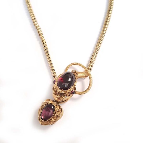 Victorian Antique Garnet and Gold Snake Necklace, intricate articulated 18ct yellow gold scales to snake's head with oval cabochon garnet suspending heart shaped locket pendant with lock of hair to the reverse. Circa 1850