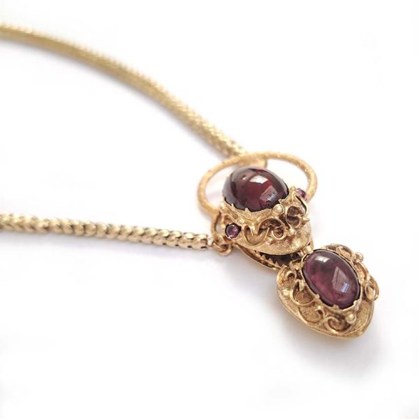 Victorian Antique Garnet and Gold Snake Necklace, intricate articulated 18ct yellow gold scales to snake's head with oval cabochon garnet suspending heart shaped locket pendant with lock of hair to the reverse. Circa 1850