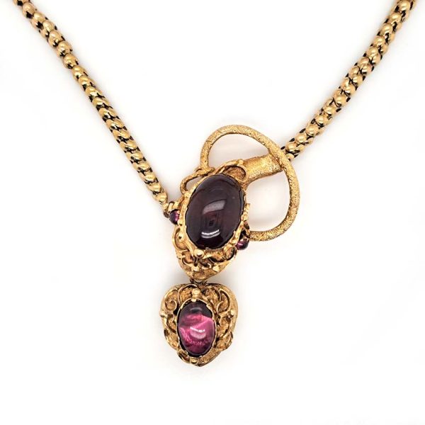 Victorian Antique Garnet and Gold Snake Necklace, intricate articulated 18ct yellow gold scales to snake's head with oval cabochon garnet suspending heart shaped locket pendant with lock of hair to the reverse. Circa 1850
