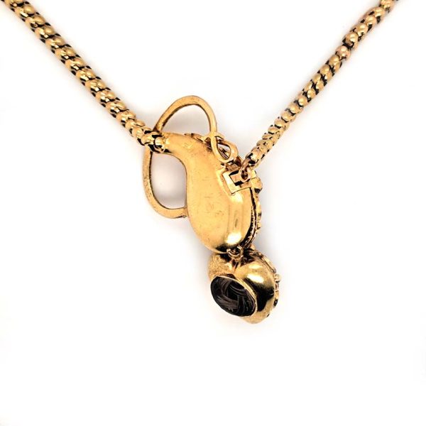 Victorian Antique Garnet and Gold Snake Necklace, intricate articulated 18ct yellow gold scales to snake's head with oval cabochon garnet suspending heart shaped locket pendant with lock of hair to the reverse. Circa 1850