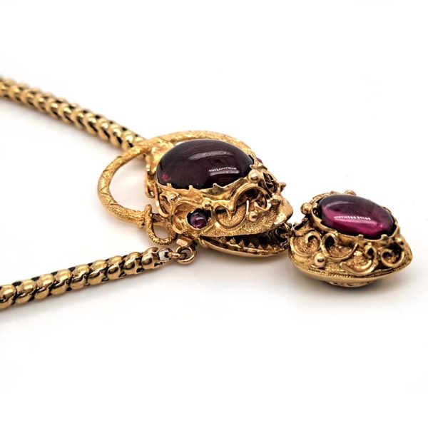 Victorian Antique Garnet and Gold Snake Necklace, intricate articulated 18ct yellow gold scales to snake's head with oval cabochon garnet suspending heart shaped locket pendant with lock of hair to the reverse. Circa 1850