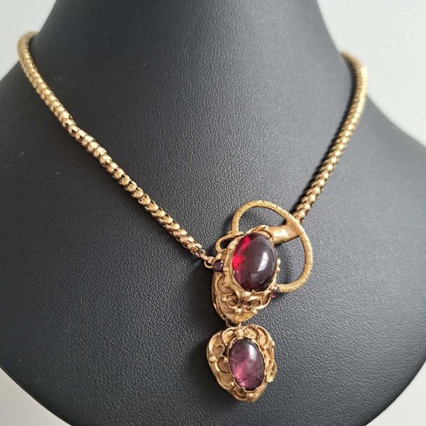 Victorian Antique Garnet and Gold Snake Necklace, intricate articulated 18ct yellow gold scales to snake's head with oval cabochon garnet suspending heart shaped locket pendant with lock of hair to the reverse. Circa 1850