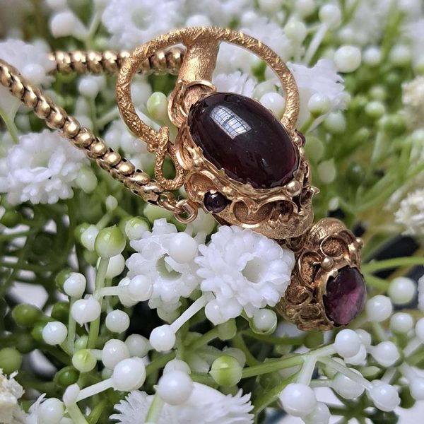 Victorian Antique Garnet and Gold Snake Necklace, intricate articulated 18ct yellow gold scales to snake's head with oval cabochon garnet suspending heart shaped locket pendant with lock of hair to the reverse. Circa 1850