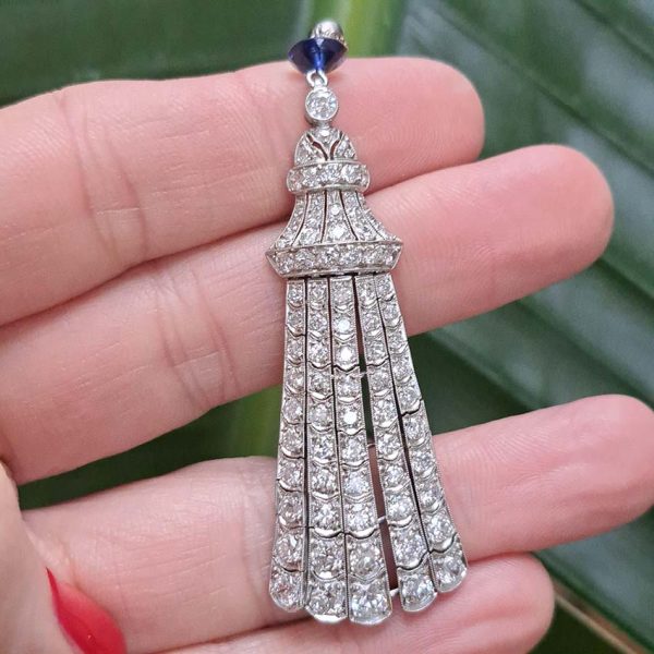 Antique Belle Epoque 3ct Diamond Fringe Pendant in Platinum, five fringe drops set with single-cut diamonds which tapers to the bell cap top ,single sapphire and old-cut diamond solitaire accents