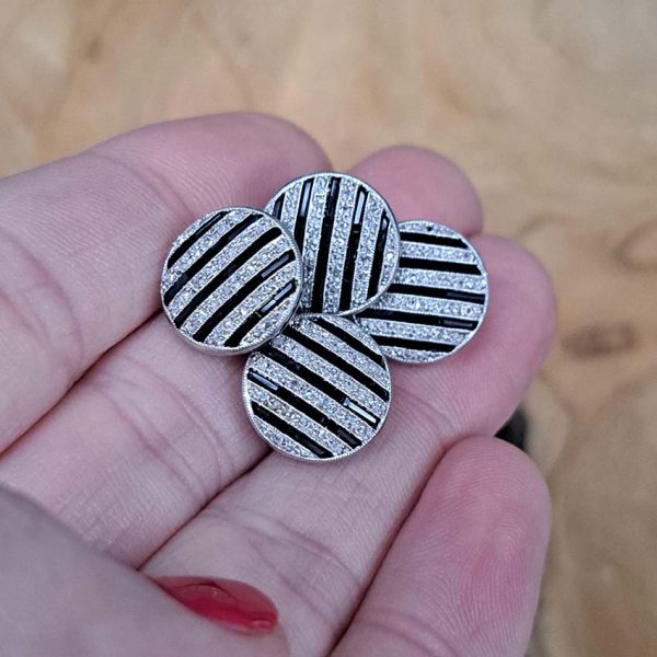 Antique Black Onyx and Diamond Cufflinks, composed of alternating lines of black onyx and sparkling rose-cut diamonds in 18ct white gold