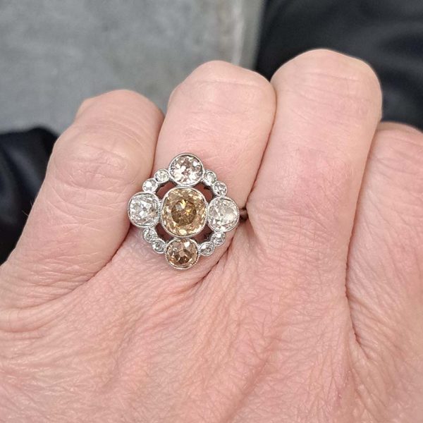Antique 3.7cts Fancy Champagne Diamond Quatrefoil Ring, 1.57ct old mine-cut champagne diamond surrounded by four further old mine-cut diamonds of varying champagne hues arranged at the four compass points, with smaller old-cut diamond accents between in platinum and 18ct white gold