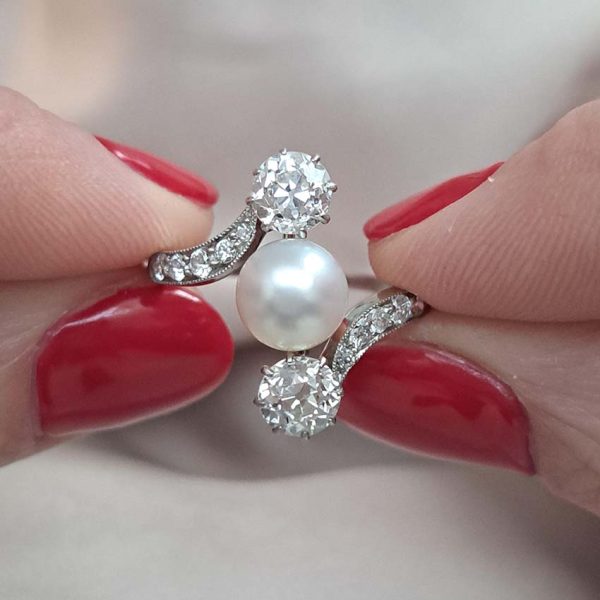 Antique Natural Pearl and Old Cut Diamond Three Stone Ring, natural pearl and 1.44cts old mine cut diamonds with diamond crossover shoulders in 18ct white gold