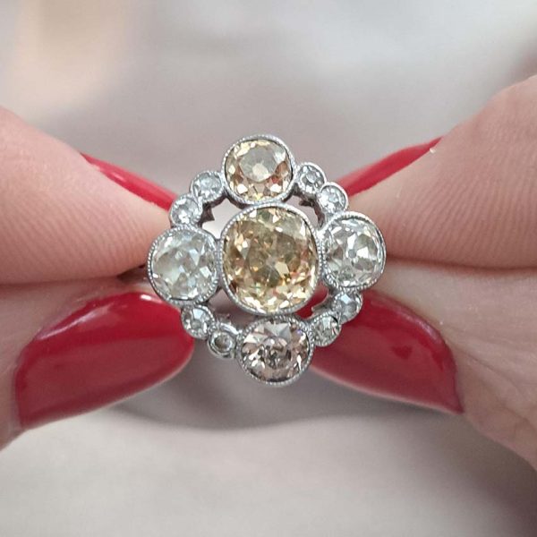 Antique 3.7cts Fancy Champagne Diamond Quatrefoil Ring, 1.57ct old mine-cut champagne diamond surrounded by four further old mine-cut diamonds of varying champagne hues arranged at the four compass points, with smaller old-cut diamond accents between in platinum and 18ct white gold