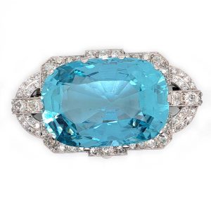 Large Art Deco Aquamarine and Old Cut Diamond Cluster Brooch, large central 67.15ct oval aquamarine within 2ct diamond studded geometric surround in 18ct white gold