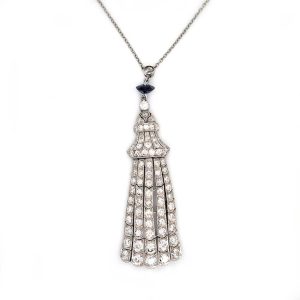 Antique Belle Epoque 3ct Diamond Fringe Pendant in Platinum, five fringe drops set with single-cut diamonds which tapers to the bell cap top ,single sapphire and old-cut diamond solitaire accents