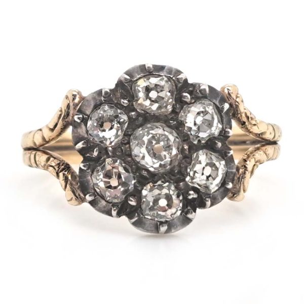 Antique Old Cut Diamond Flower Cluster Engagement Ring, 0.80 carat total, old mine-cut diamond surrounded by six diamonds in timeless floral design in yellow gold with decorative split shoulders