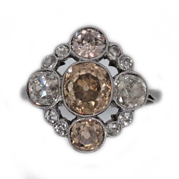 Antique 3.7cts Fancy Champagne Diamond Quatrefoil Ring, 1.57ct old mine-cut champagne diamond surrounded by four further old mine-cut diamonds of varying champagne hues arranged at the four compass points, with smaller old-cut diamond accents between in platinum and 18ct white gold