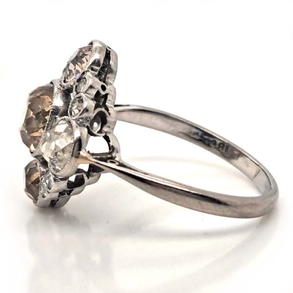 Antique 3.7cts Fancy Champagne Diamond Quatrefoil Ring, 1.57ct old mine-cut champagne diamond surrounded by four further old mine-cut diamonds of varying champagne hues arranged at the four compass points, with smaller old-cut diamond accents between in platinum and 18ct white gold