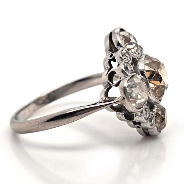 Antique 3.7cts Fancy Champagne Diamond Quatrefoil Ring, 1.57ct old mine-cut champagne diamond surrounded by four further old mine-cut diamonds of varying champagne hues arranged at the four compass points, with smaller old-cut diamond accents between in platinum and 18ct white gold