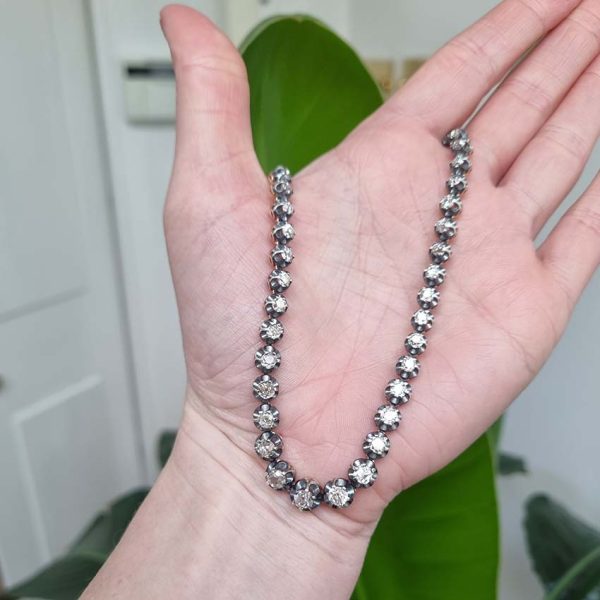 Antique 10.7ct Old Cut Diamond Line Necklace, 73 graduating old mine-cut diamonds in individual crown settings in silver upon yellow gold, 43.3cm long