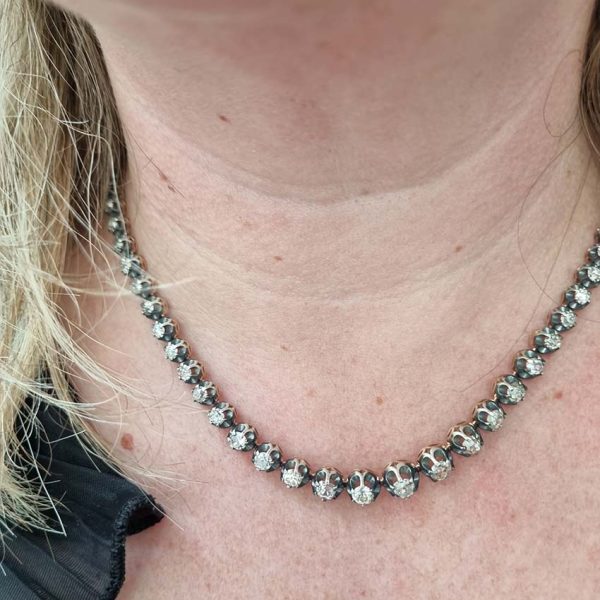 Antique 10.7ct Old Cut Diamond Line Necklace, 73 graduating old mine-cut diamonds in individual crown settings in silver upon yellow gold, 43.3cm long