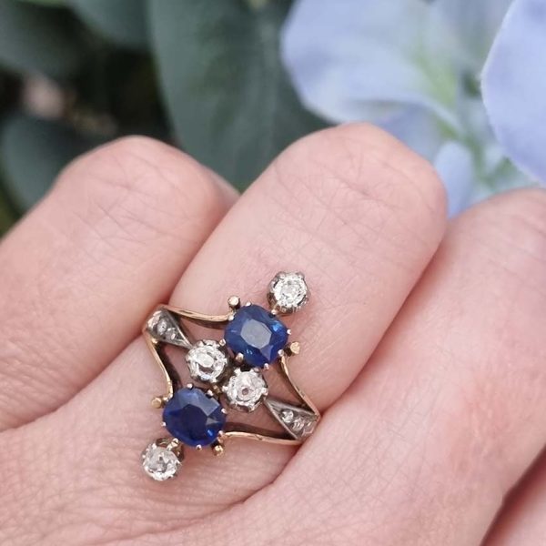 Victorian Antique Sapphire and Diamond Dress Ring, two cushion cut sapphires accented with four old mine-cut diamonds in 18ct yellow gold