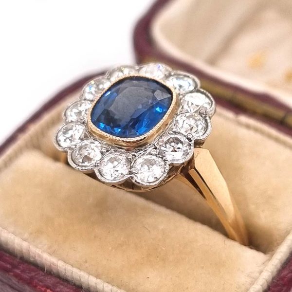 Vintage 1ct Cushion Cut Sapphire and Old Cut Diamond Floral Cluster Engagement Ring in platinum to 18ct yellow gold