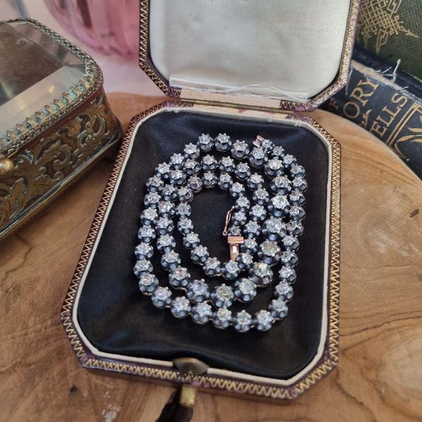 Antique 10.7ct Old Cut Diamond Line Necklace, 73 graduating old mine-cut diamonds in individual crown settings in silver upon yellow gold, 43.3cm long