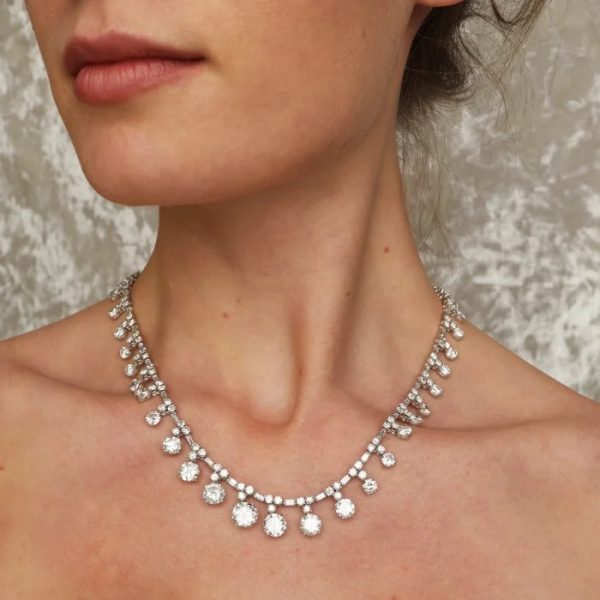 Vintage 1950s French Diamond and Platinum Riviere Necklace, 37.84 carats, graduating drops of round brilliant-cut diamonds on articulating chain of alternating brilliant and baguette-cut diamonds in platinum